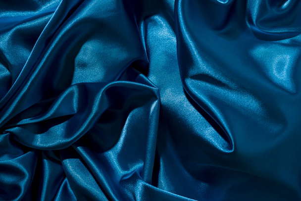 Background image of crumpled fabric. Blue silk - Foto, Imagem