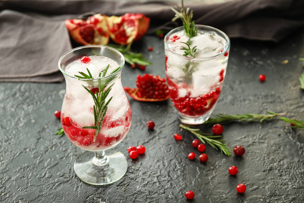 Glasses of healthy cocktail on dark background - Foto, imagen