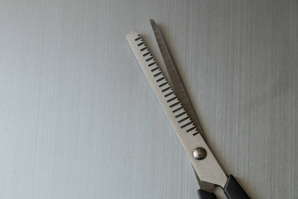 scissors for thinning on a gray background - Fotoğraf, Görsel