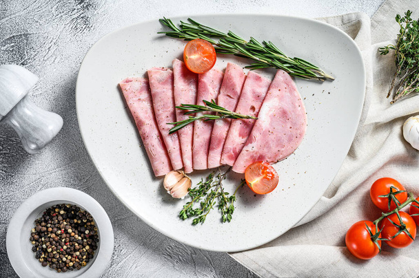 Sliced Pork ham. Fresh prosciutto. White background. Top view. - Zdjęcie, obraz