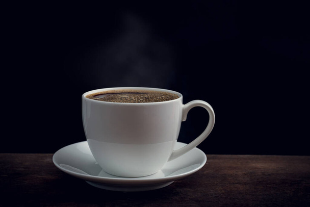 Cup of coffee on old wooden table - Φωτογραφία, εικόνα