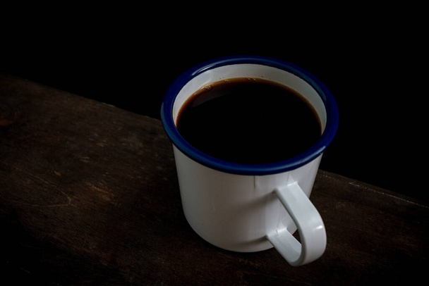 Cup of coffee on old wooden table - Φωτογραφία, εικόνα
