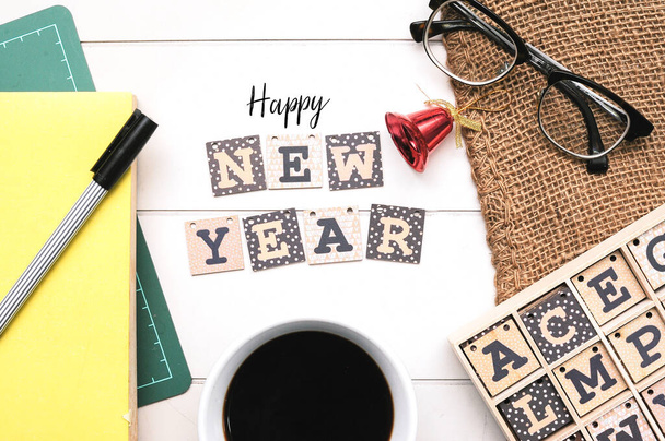 Wooden alphabet block forming word Happy New Year on white office desk. - Zdjęcie, obraz
