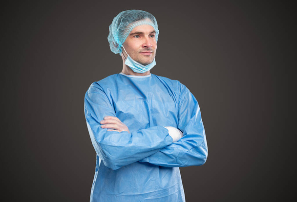 Male doctor in protective uniform in studio - Foto, Imagen