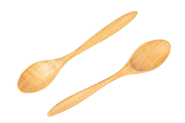 Dos cucharas de madera aisladas sobre fondo blanco
. - Foto, Imagen