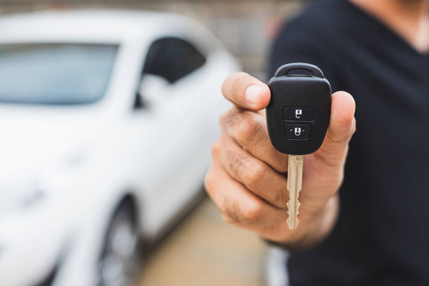Businessman giving a car key. Getting new car. - Foto, Imagem