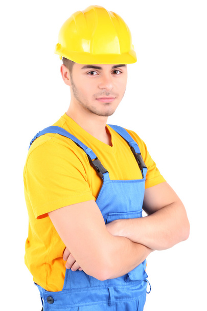 Male builder in yellow helmet isolated on white - Fotó, kép