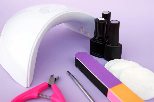 Set for manicure. Lamp for nails. Master of nail service. - Photo, Image
