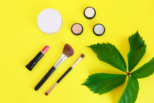 decorative cosmetics, eye shadow, lipstick, mascara a makeup brushes - Photo, Image