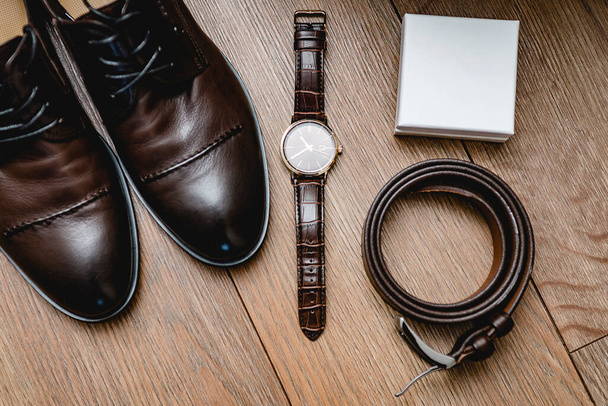 Wedding attributes of the groom. shoes, watch, belt, box for decoration. Close-up - Fotó, kép