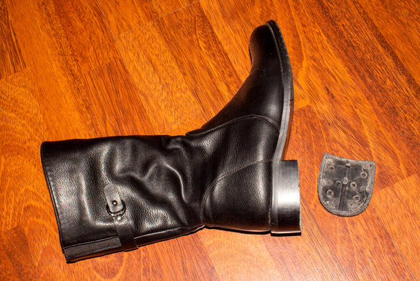 A broken heel on a Shoe.Shoe padding on shoes.Shoe repair. - Photo, Image