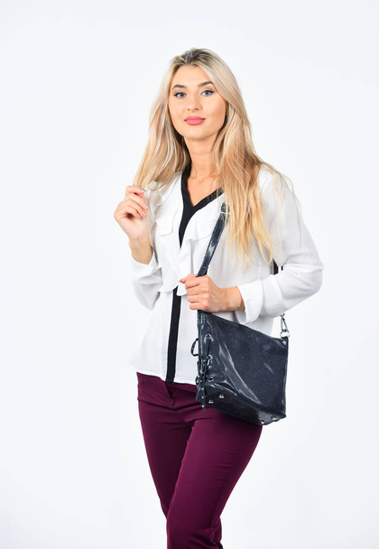 sexy girl carry black leather bag. beauty and fashion accessory. beauty of woman isolated on white. casual and everyday style. female fashion style. business woman with long blonde hair - 写真・画像