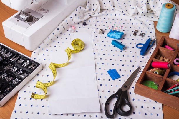 Pastel color background, Dressmaker and designer desk, Handcraft accessories: threads roll, scissors and button. Close up. - Fotoğraf, Görsel