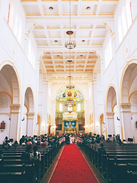 An inside view of a church during a wedding ceremony - Zdjęcie, obraz