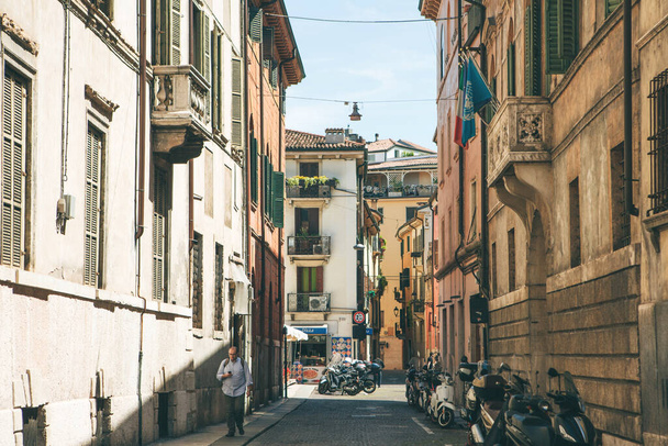 Italy, Verona, June 01, 2019: View of a traditional Italian street with ancient architecture - Photo, Image