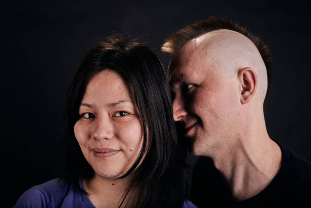 Portrait of mixed race couple in the studio. Two people together. - Photo, Image