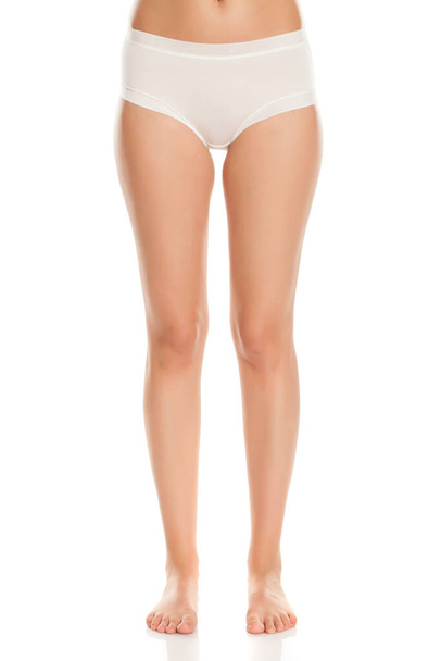pretty feminine legs and white panties on white background - Photo, Image