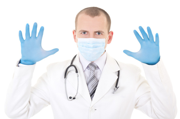 τρομακτική γιατρός σε μπλε μάσκα και λαστιχένια γάντια που απομονώνονται σε wh - Φωτογραφία, εικόνα