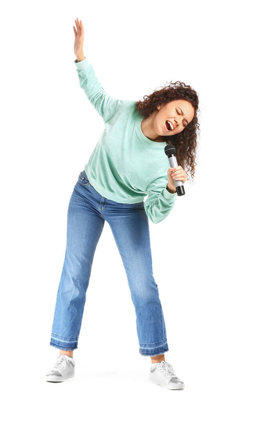 Young African-American woman singing on white background - Foto, Imagem
