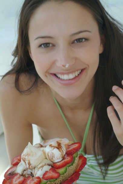 Beautiful woman enjoying fruit dessert with icecream - Zdjęcie, obraz