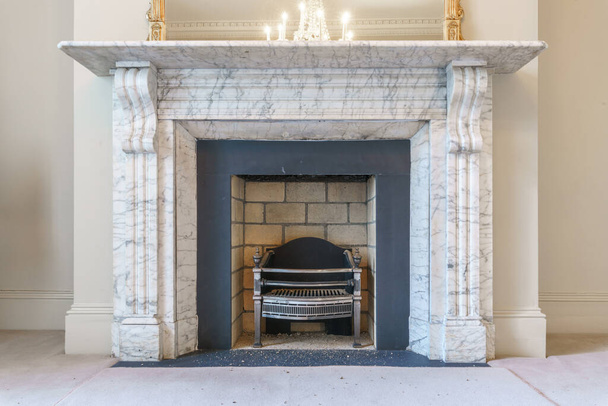 Traditional large fireplace in a living room  - Photo, Image