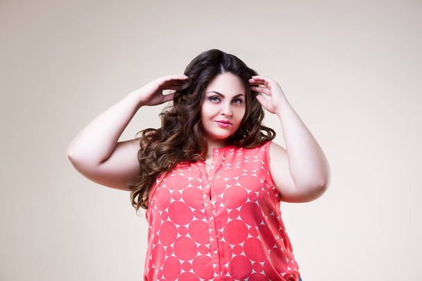 Happy plus size fashion model in casual clothes, cheerful fat woman on beige background, body positive concept - Foto, immagini