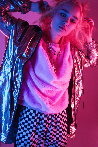 beautiful girl posing on a neon color background - Φωτογραφία, εικόνα