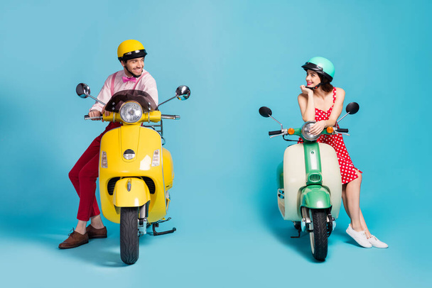 Portrait of his he her she nice attractive cheerful cheery couple sitting on moped wearing retro festal look communicating acquaintance isolated on bright vivid shine vibrant blue color background - Фото, изображение
