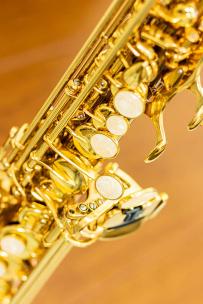 close up on soprano saxophone details, blurred background - Foto, imagen