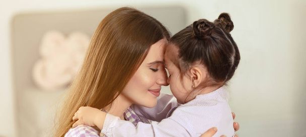 Young mother with little daughter at home. Banner design - Фото, зображення