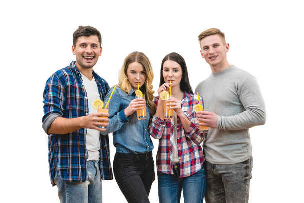 The four people drink cocktails on a white background - Fotografie, Obrázek