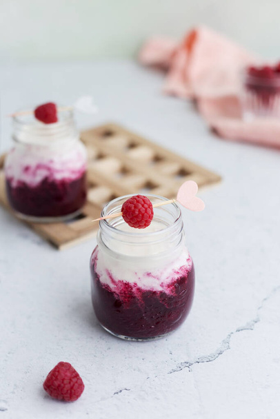 Mix berry smoothie with raspberry, blackberry and yogurt in glass jars at light background - Foto, immagini