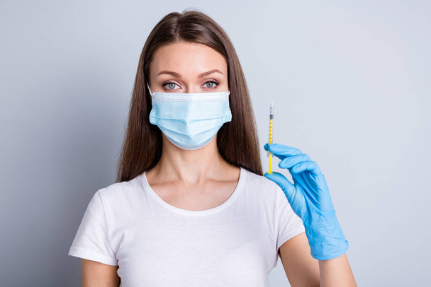 Closeup photo of lady family doctor hospital examination raise arm prepare syringe dose patient vaccine injecting treatment therapy wear protect face mask isolated grey color background - Foto, Bild