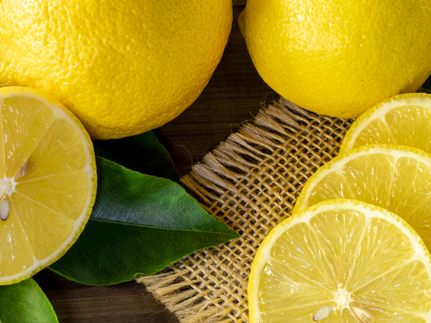 Close up of lemon on wooden background - Photo, Image