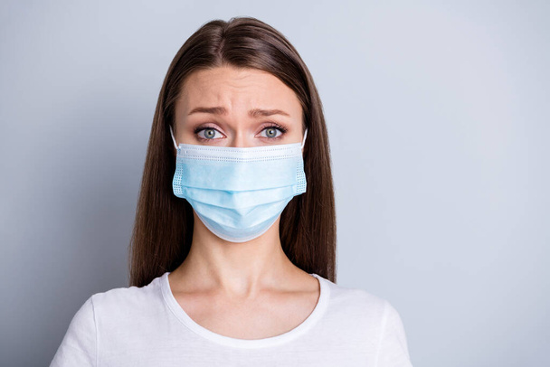 Close up photo of pretty lady had contact with infected people came hospital examination patient crying terrified covid wear protect face medical mask t-shirt isolated grey color background - Foto, imagen