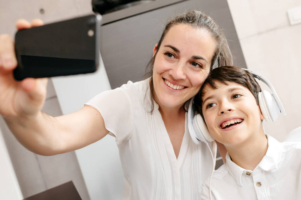 mother and son smiling taking a selfie - Photo, image