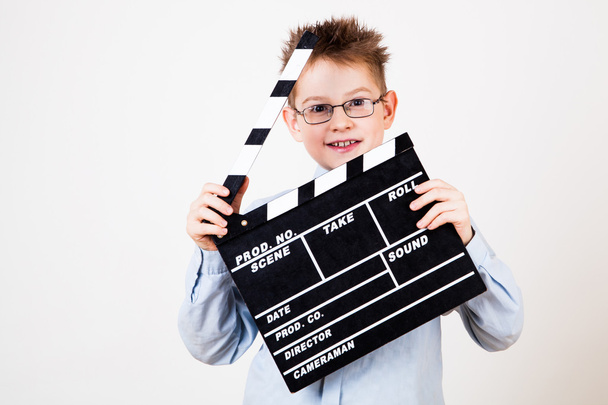 Boy holding clapper board - Фото, зображення