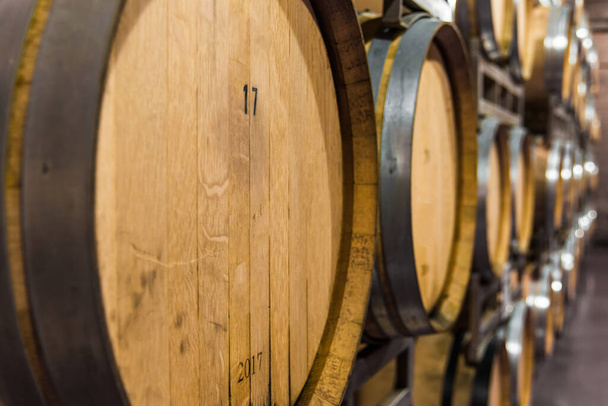 Oak wine barrels for wine fermentation at a winery. - Photo, Image