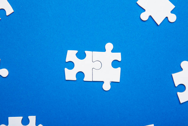 Pieces of jigsaw puzzle on color background. Unity concept - Photo, Image