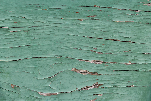 Close-up άποψη ενός teal μπλε ζωγραφισμένα παλιά ξύλινη επιφάνεια, γερασμένη υφή φόντου, επίπεδη lay στοιχείο σχεδιασμού - Φωτογραφία, εικόνα
