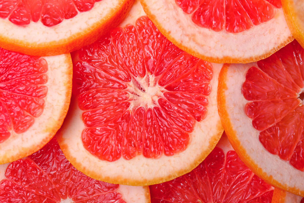 Friss vágott grapefruit mint háttér - Fotó, kép