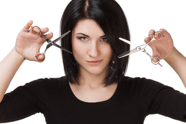 Professional hairdresser with tools posing in studio - Foto, imagen