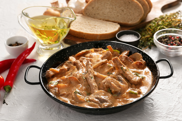 Tasty beef stroganoff with products on white background - Photo, Image