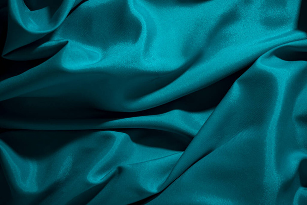 Background image of crumpled fabric. Blue silk - Photo, Image