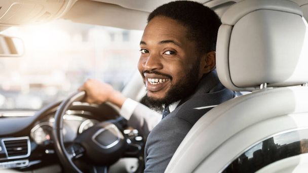 Cheerful Black Man Driving Automobile Sitting In Drivers Seat, Panorama - Photo, Image
