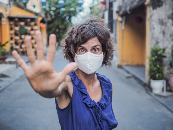 woman wearing protective mask and blue dress, coronavirus pandemic and quarantine concept - Fotografie, Obrázek