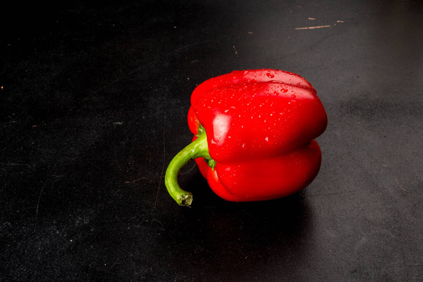 Red chili pepper on black background - Foto, imagen