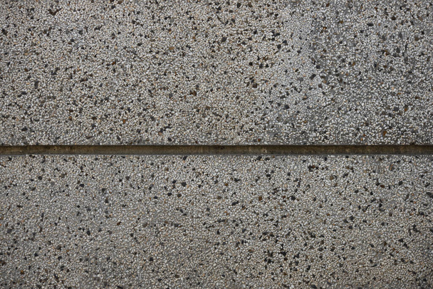 Feche um monte de pedras pequenas ou minúsculas que são misturadas com cimento. A superfície da parede de concreto, textura de piso e fundo para web design e arquiteto
. - Foto, Imagem