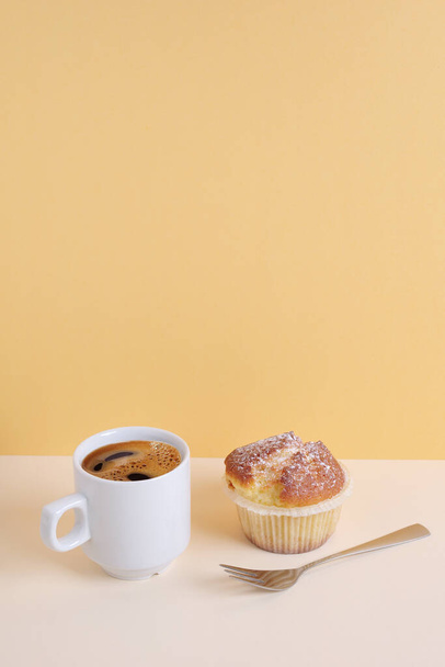 Cupcake and cup of coffee on table. Copy space - Foto, imagen