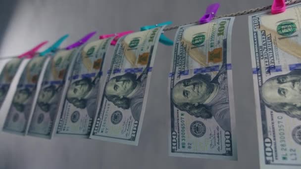 Money laundering concept. Dollar bills are dried on a rope. Pure money. - Footage, Video